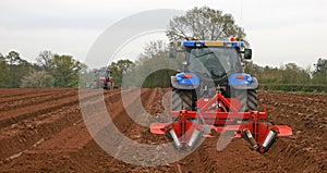 Tractors ploughing