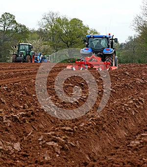 Tractors ploughing