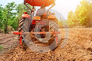 Tractors plow furrow for planting agriculture farmland
