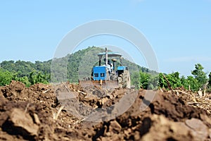 Tractors preparing the soil for planting.