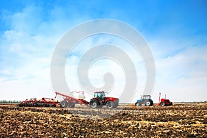 Tractors with tanks in the field. Agricultural machinery and farming. photo