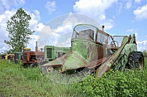 Tractors and two row mounted corn picker