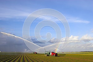 Tractors watering plants