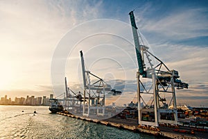 Trade, commerce, business. Maritime container port with cargo ship, cranes. Sea port, terminal or dock. Freight