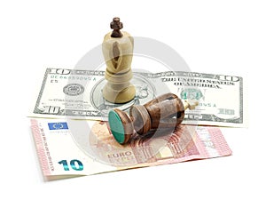 Trade Concept: King Chess Pieces On Dollar And Euro Banknotes, Isolated On White