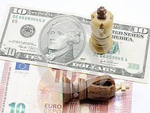 Trade Concept: King Chess Pieces On Dollar And Euro Banknotes, Isolated On White