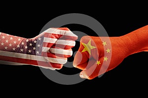 Trade conflict, fists with the flags of USA and China against ea