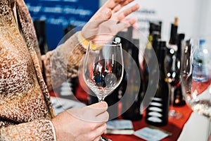 Trade Visitors Networking Over Wine Tasting at Wine Fair