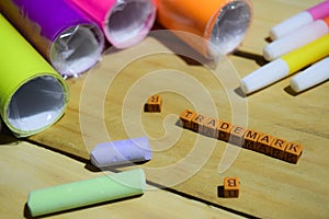 Trademark on wooden cubes with colorful paper and pen, Concept Inspiration on Wooden background