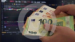 Trader Counting Euros Chart on Background