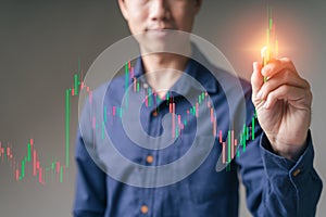 Trader with Cryptocurrency, stock market graph chart concept. Trader, investor, business man pointing on technical price graph,