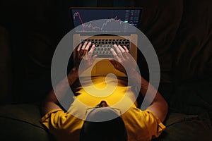Trader investor using stockmarket app on laptop