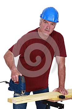 Tradesman using a jigsaw