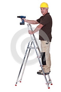 Tradesman using a power tool