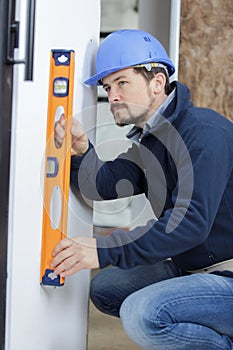tradesman using spirit level