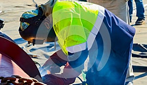 Tradesman working with welding torch