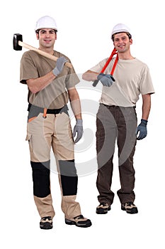 Tradesmen holding their tools photo