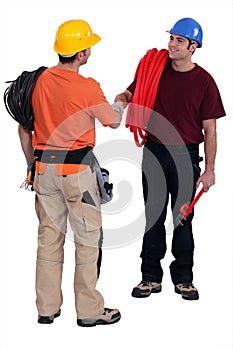 Tradesmen shaking hands