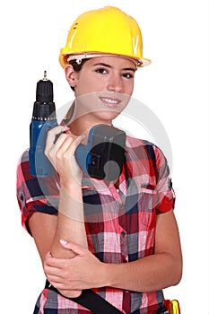 Tradeswoman holding a power tool