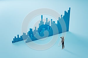 Trading and stock market concept with pensive woman back view looking at big graphic financial chart graph on light blue