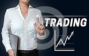 Trading touchscreen is operated by businesswoman