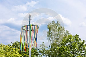 Tradiotional maypole with blue sky