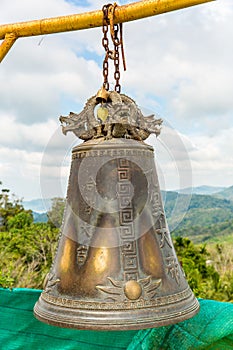 Tradition asian bell in Buddhism temple in Phuket island,Thailand. Famous Big bell wish near Gold Buddha