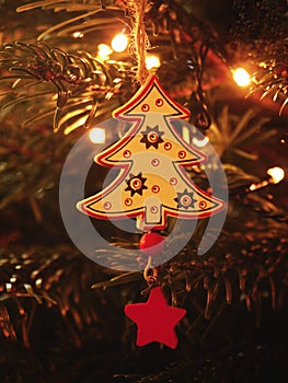 Tradition Christmas decoration made from dry light wood. Christmas tree with small gentle lights.