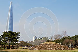 Tradition and modernity: Baekje grave sites in front of skyline, Seoul, Korea