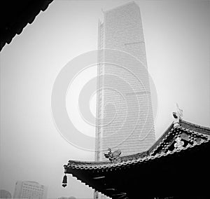 Tradition and modernity in China. Skyscrapers, traditional roof and the sky