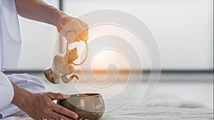 Tradition practice of Thai buddhist to pour ceremonial water to give merit