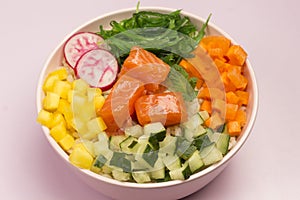 Traditiona Hawaiian red fish poke bowl with rice, radish,cucumber, tomato, and seaweeds. Buddha bowl