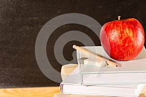 Traditional academic study school books and apple