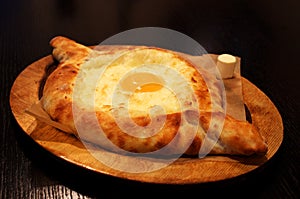 traditional adjarian georgian and armenian cuisine, khachapuri with suluguni cheese and egg yolk