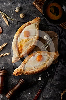Traditional Adjarian khachapuri pies with salted cheese and egg
