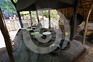 Traditional African food cooked inside Tanzanian clay pots on clay stove at Mto wa Mbu, village, Tanzania, Africa photo