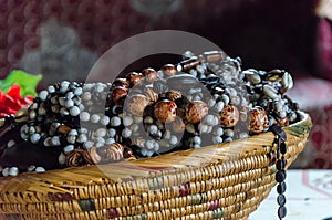 Traditional African jewelry stacked in straw basket at historical Fon`s palace, Bafut, Cameroon, Africa