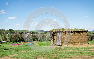 Traditional african masai hut with clothing scattered