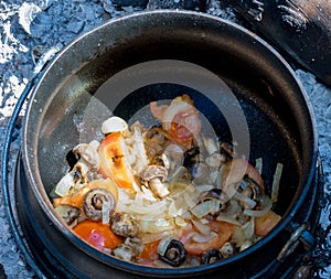 Traditional Afrikaner cooking method outdoors