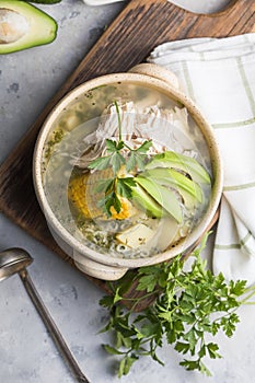 Traditional Ajiaco Colombiano - Colombian Soup with potato, chicken, avocado photo