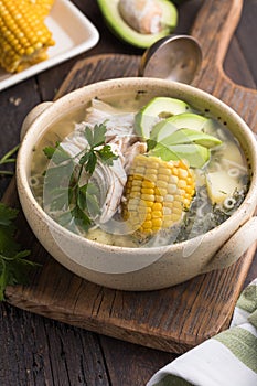 Traditional Ajiaco Colombiano - Colombian Soup with potato, chicken, avocado photo