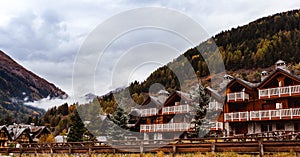 Traditional alpine houses in mountains, Dolomites Mountains, Italy