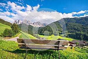 Traditional alpine St Johann church in Val di Funes valley, Santa Maddalena touristic village, Dolomites, Italy.