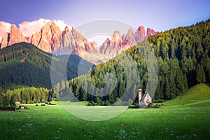 Traditional alpine St Johann church in Val di Funes valley, Santa Maddalena touristic village, Dolomites, Italy.