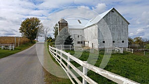 A traditional Amish barn and a white picket fence in Ohio, USA