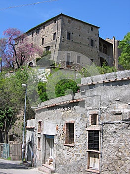 Traditional antique manor stone house in the Roman countryside to spring in Italy.