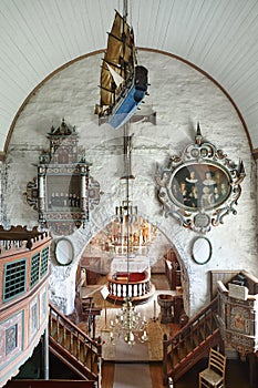 Traditional antique norwegian interior stone church. Luster. Travel Norway.