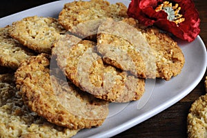 Traditional Anzac biscuits on dark recycled wood