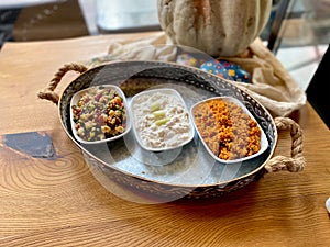 Traditional Appetizer Bulgur or Bulghur Kisir, Celery Salad and Chickpea Lentil Salad. Turkish Greek Food in Copper Tray at Local