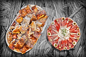 Traditional Appetizer Savory Dish and Spit Roasted Pork Meat Served on Rustic Chipboard Vignette Background